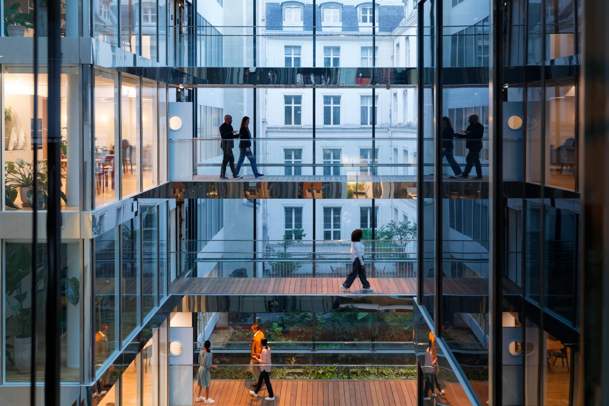 Professionals in a modern office atrium